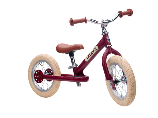Draisienne Trybike rouge vintage 2 roues, vue de trois quarts